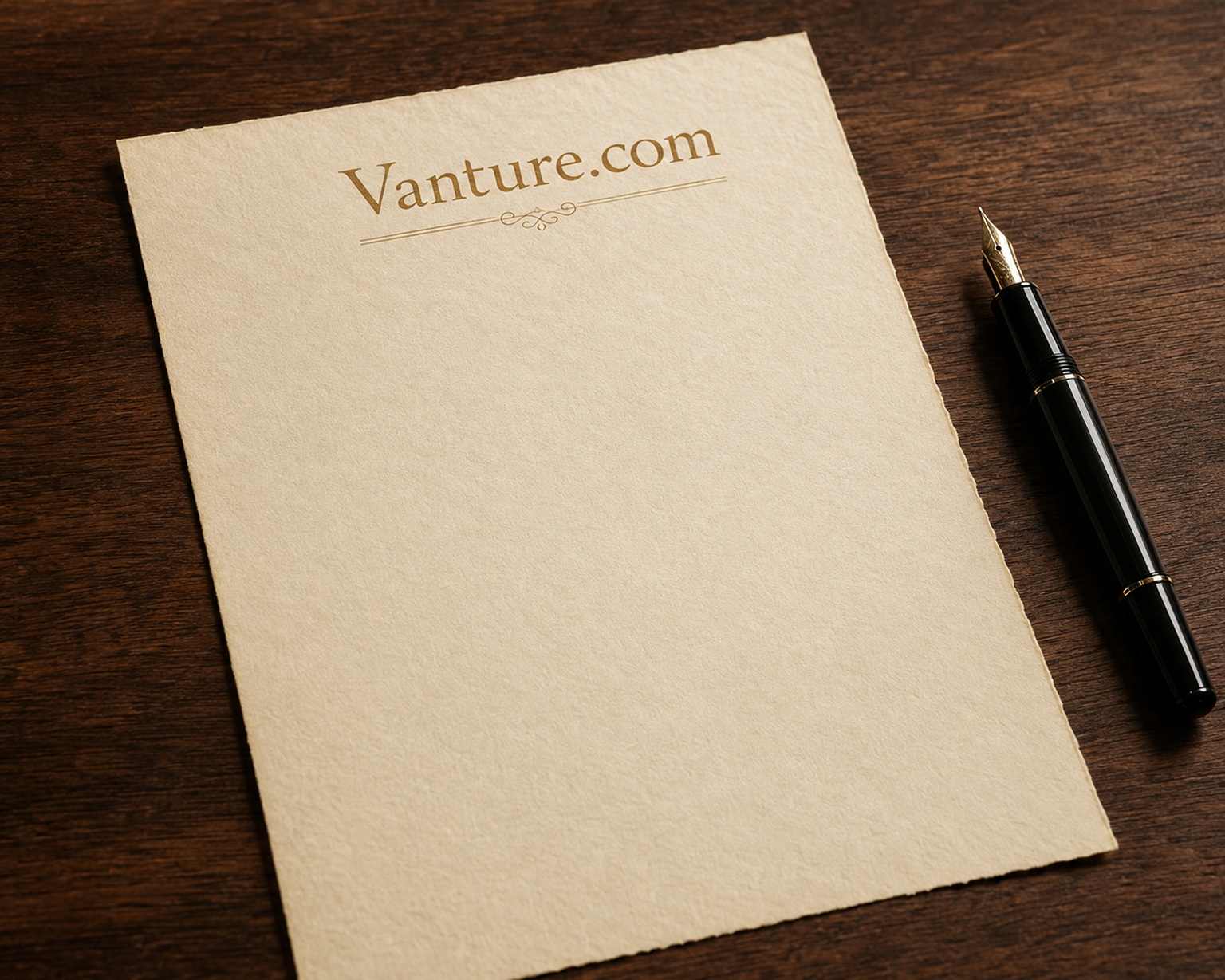Vanture.com letterhead on a walnut desk